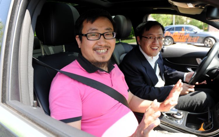Chinese business people looking forward to trying out the off-road course at the Mercedes-Benz plant in Bremen