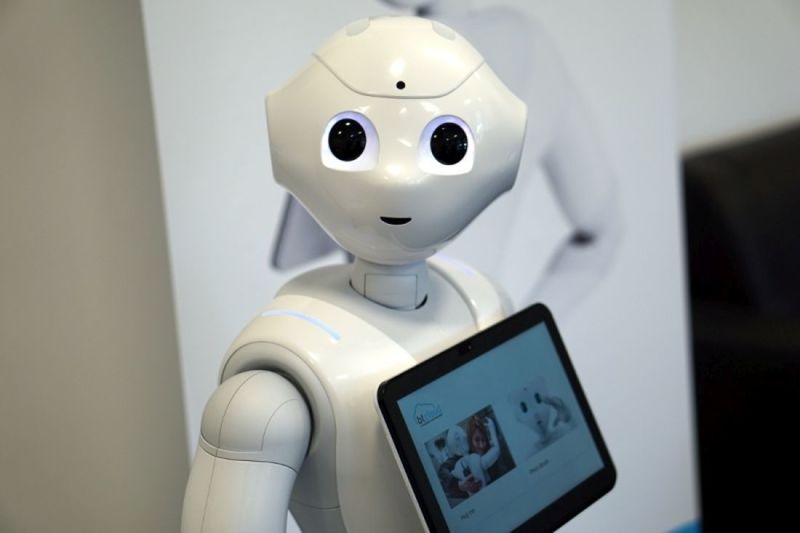 The robot displays information and can be controlled via the large tablet on its chest.